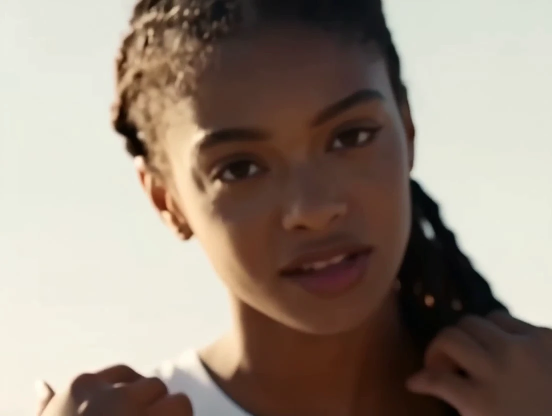 Close-up of the singer with long braids
